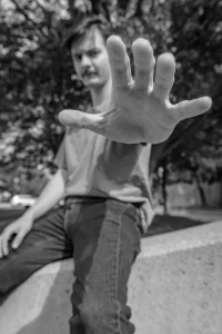 Manticore Marketing team member reaching toward the camera, black and white